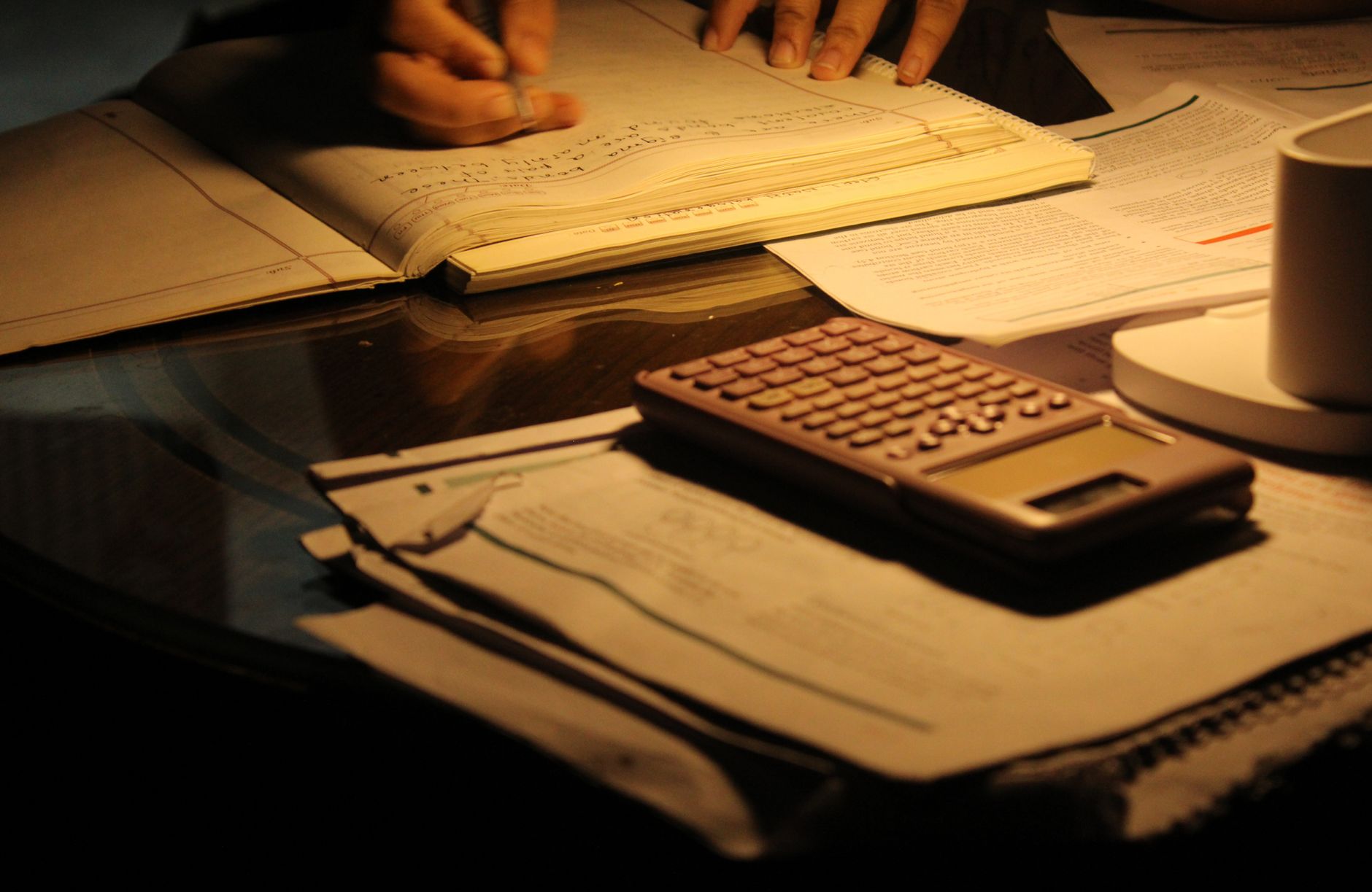 evening study session with calculator and books