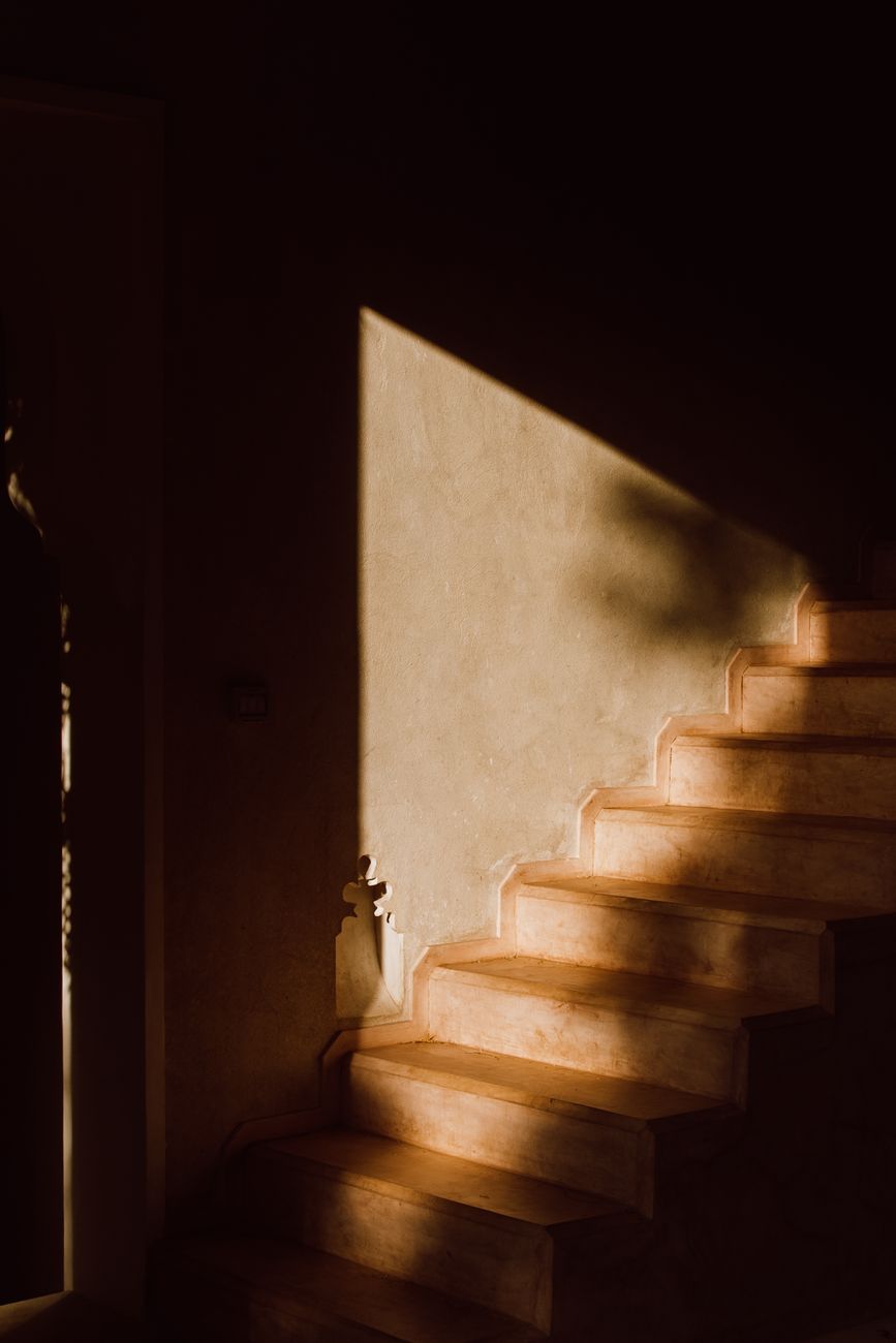 concrete staircase beside the door