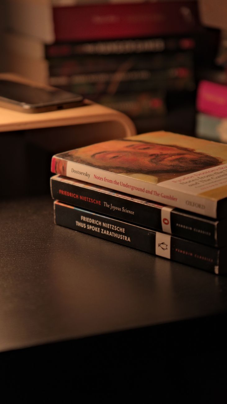 stack of philosophy books on a desk