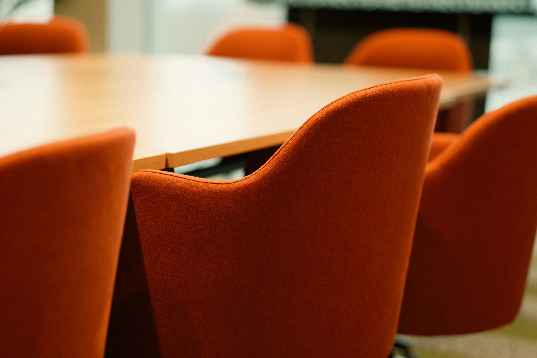 modern conference room with orange chairs