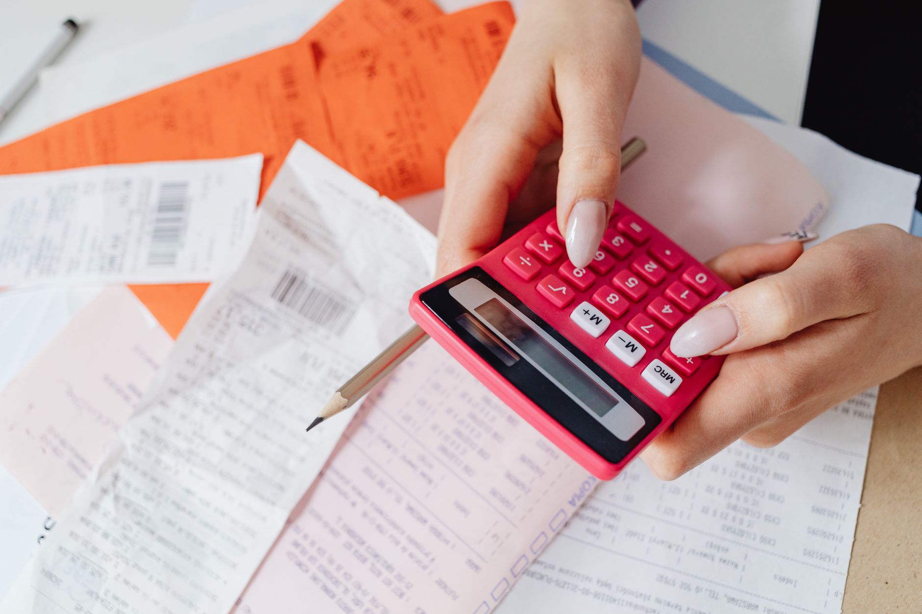 a close up shot of a person using a calculator