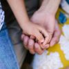 close up shot holding hands