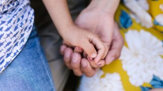 close up shot holding hands