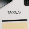 notepad and calculator on white background
