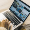 a person using a silver laptop